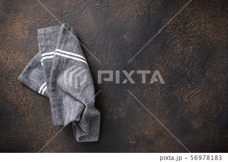 Gray linen napkin on rusty table 56978183