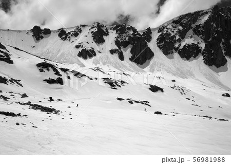 Black and white high mountains with snow cornice 56981988