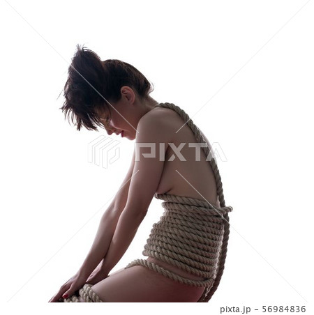 Shibari. Side view of nude girl tied with rope 56984836