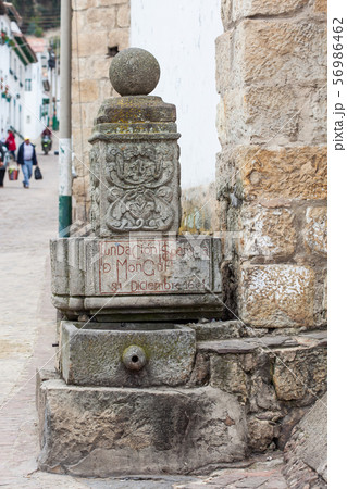 Stone fountain with date of founding of Mongui 56986462