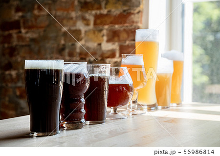 Glasses of different kinds of beer, time for oktoberfest Glasses of different kinds of beer, time for oktoberfest 56986814