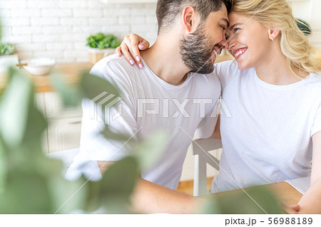 Smiling pretty woman is hugging her boyfriend Smiling pretty woman is hugging her boyfriend 56988189