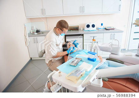 Woman having dental procedure at modern clinic 56988394