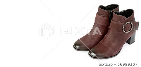 Stylish suede ankle boots isolated on white 56989307