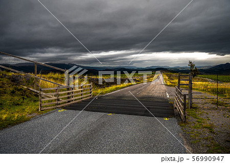 Narrow Road Through Rural Highland Landscape Near Loch Ness In Scotland 56990947
