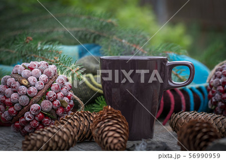Fall still life with cup of tea on rustic board 56990959