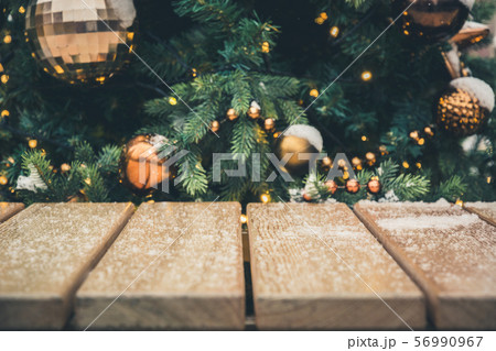 Blurred gold garland and wooden board Blurred gold garland and wooden board 56990967