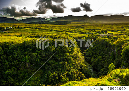 Rural Landscape With Remote Houses At The Old Man Storr Formation On The Isle Of Skye In Scotland Rural Landscape With Remote Houses At The Old Man Storr Formation On The Isle Of Skye In Scotland 56991040
