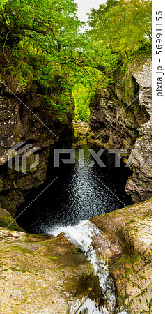 Waterfall Falls Of Foyers In Narrow Gorge With Old Stone Bridge At Loch Ness In Scotland 56991156