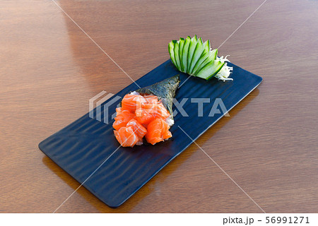 Salmon sashimi temaki roll. Japanese sea food Salmon sashimi temaki roll. Japanese sea food 56991271