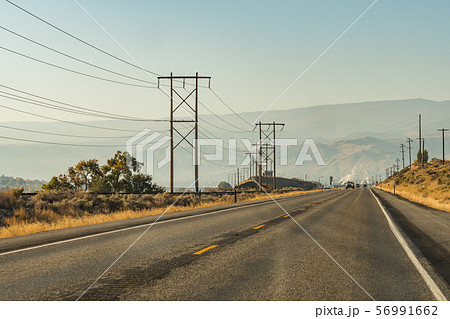 Road and smoke from chimneys in the background on Highway 2 in Wenatchee 56991662