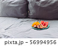 Plate with tropical fruit in grey bed, pilow 56994956