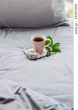 good morning, chill witn coffee in grey bed 56994968