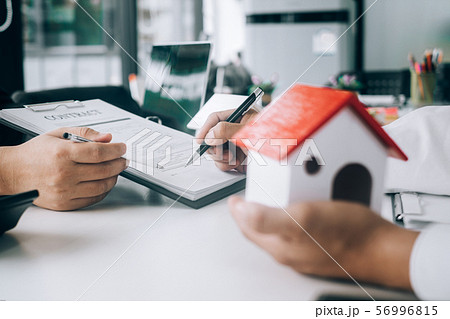 Real estate agents submit documents for customers 56996815