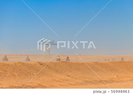 Safari trip through egyptian desert driving ATV. Safari trip through egyptian desert driving ATV. 56998963