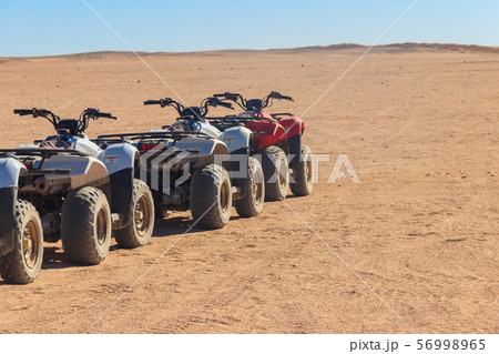 ATV quad bikes for safari trips in Arabian desert ATV quad bikes for safari trips in Arabian desert 56998965