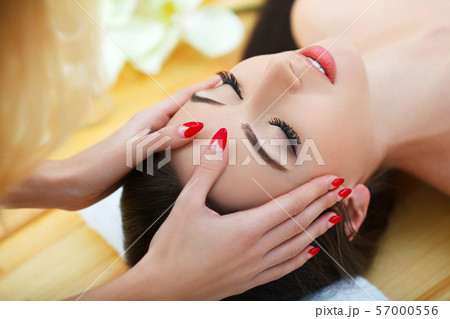 Spa salon. Young woman lying on a massage table,relaxing. 57000556