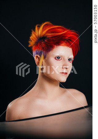 Portrait of fashion punk model with colorful dyed hair 57003150