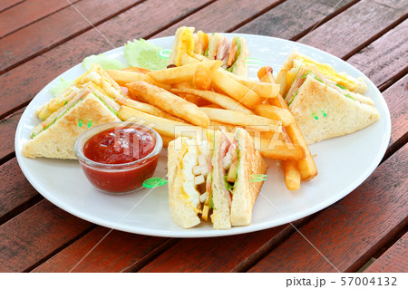 French fries with tomato ketchup on wooden 57004132