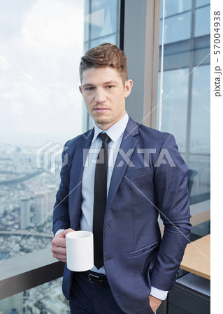 Entrepreneur drinking coffee Entrepreneur drinking coffee 57004938