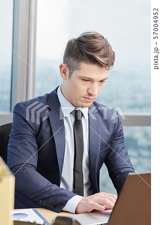 Young businessman working on office Young businessman working on office 57004952