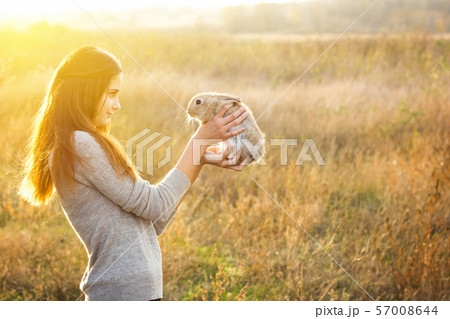 the girl with the rabbit.happy the girl with the rabbit.happy 57008644