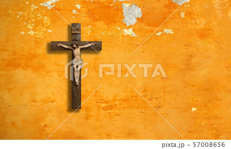 Catholic, christian cross on a shabby wall. Catholic, christian cross on a shabby wall. 57008656