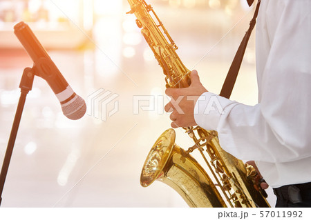 Young jazz musician plays the saxophone 57011992