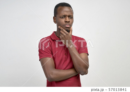 man looks down, tries to remember something man looks down, tries to remember something 57013841