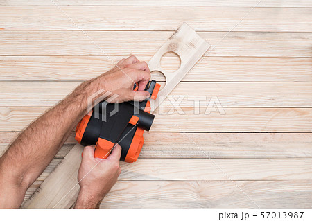 Electric planer in the male hand. Processing of Electric planer in the male hand. Processing of 57013987