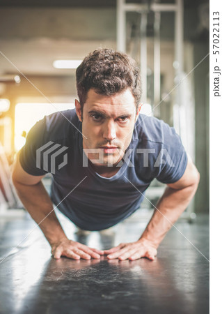 Handsome man and strong guy doing push ups Handsome man and strong guy doing push ups 57022113
