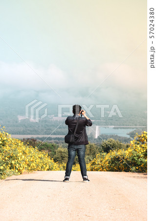 Men standing to take natural pictures,Top copy Men standing to take natural pictures,Top copy 57024380