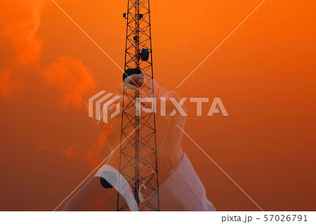 double exposure  of beautiful sky after sun set with telecommunication pole and woman hand in hand  join in telacommunication  business ,concept  joint venture. 57026791