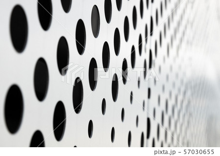 Rapid black big dot pattern on white background, round holes texture on perforated metal panel 57030655