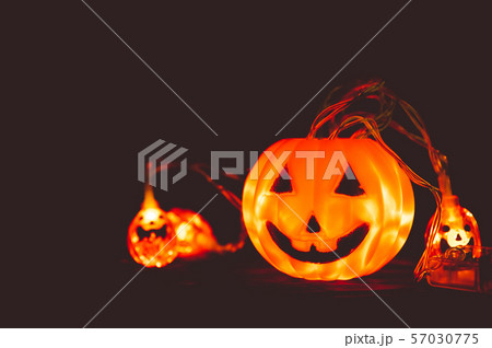 Halloween pumpkin and light in dark, wooden Halloween pumpkin and light in dark, wooden 57030775