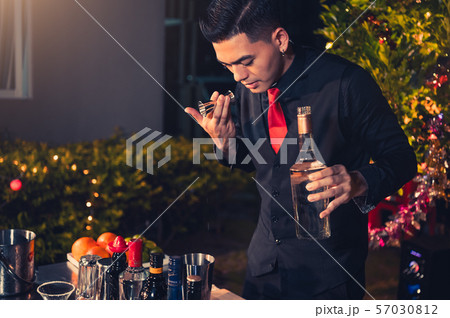 Professional bartender preparing fresh lime 57030812