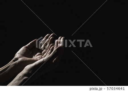 Hand of man while praying for religion. Concept Hand of man while praying for religion. Concept 57034641