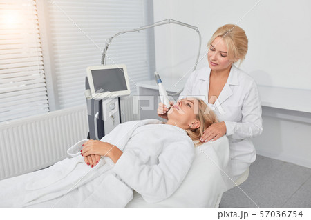 relaxed blonde client treating her unhealthy face relaxed blonde client treating her unhealthy face 57036754