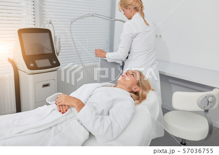blonde girl in the clinic lying on the couch and waiting for the procedure 57036755