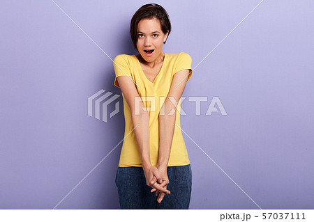 attractive beautiful woman standing in closed shy pose, smiling attractive beautiful woman standing in closed shy pose, smiling 57037111