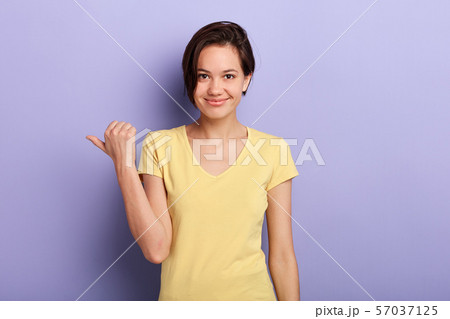 cunning adorable girl showing direction with finger cunning adorable girl showing direction with finger 57037125