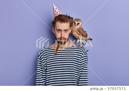 sad serious animator is being tired after working day 57037571