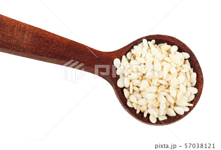 top view of spoon with white sesame seeds close-up 57038121