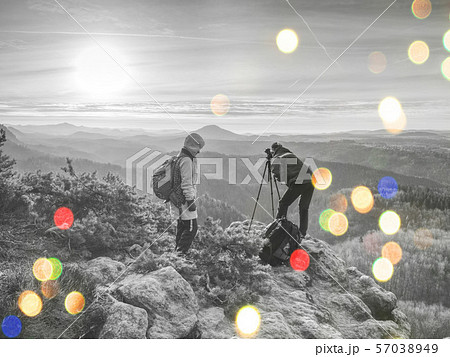 Friends photographers discuss and taking photo 57038949