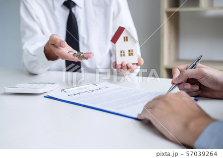 Real estate agent Sales manager holding filing Real estate agent Sales manager holding filing 57039264