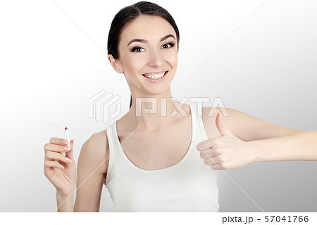 Beautiful Woman Holding Broken Cigarette. Quitting Cigarettes 57041766