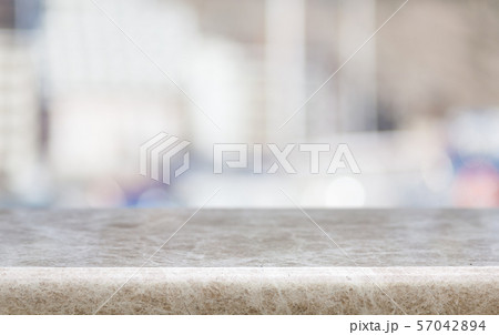 Abstract blur bokeh background with wooden desk Abstract blur bokeh background with wooden desk 57042894