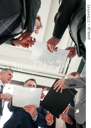 Business people work with documents 57044042