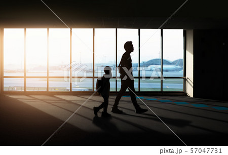 Window with silhouette people at Airport. 57047731