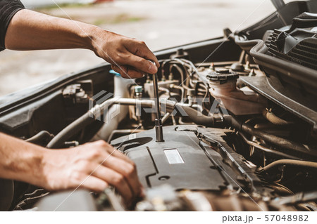 Auto mechanic working in garage Technician Hands Auto mechanic working in garage Technician Hands 57048982